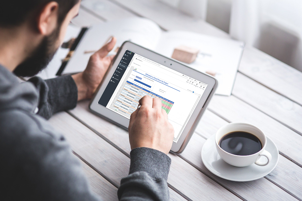 Blog header image of a man checking consolidation software for technology companies for the What Tech Companies Should Look for in Consolidation Software blog from Solver, the maker of financial reporting software